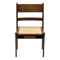 Ladder back rush seat with under-seat book rack, front view