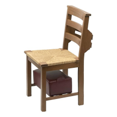 Traditional chair with third stretcher, bookrack, and stored hassock
